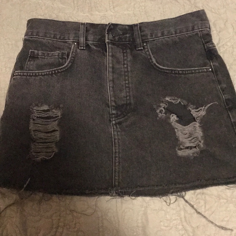 Distressed black denim skirt